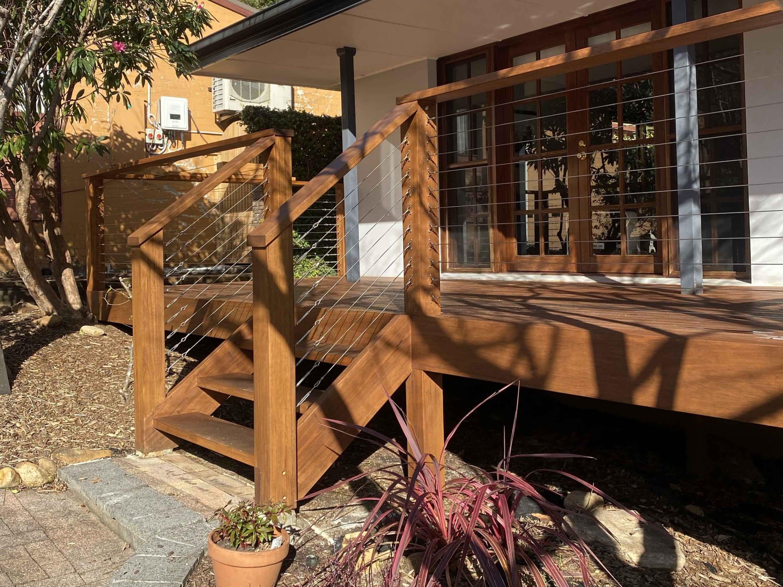 Wooden deck with modern railing design